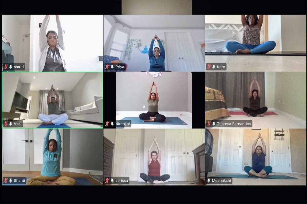 Students practising together in a GoYoga live session